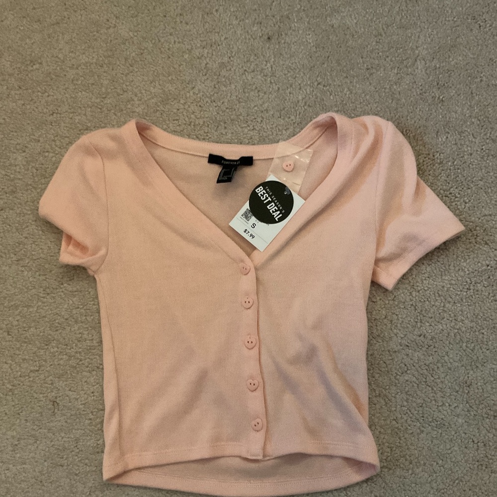 I am selling a adult women pink shirt with heart shaped buttons.